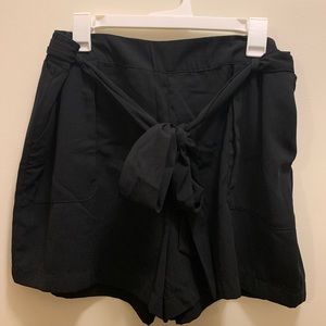 A New Day black shorts with bow/tie